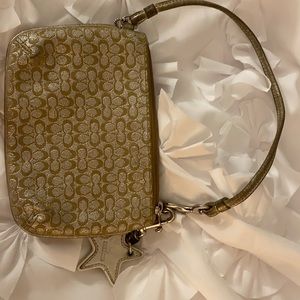 Gold and tan Coach wristlet